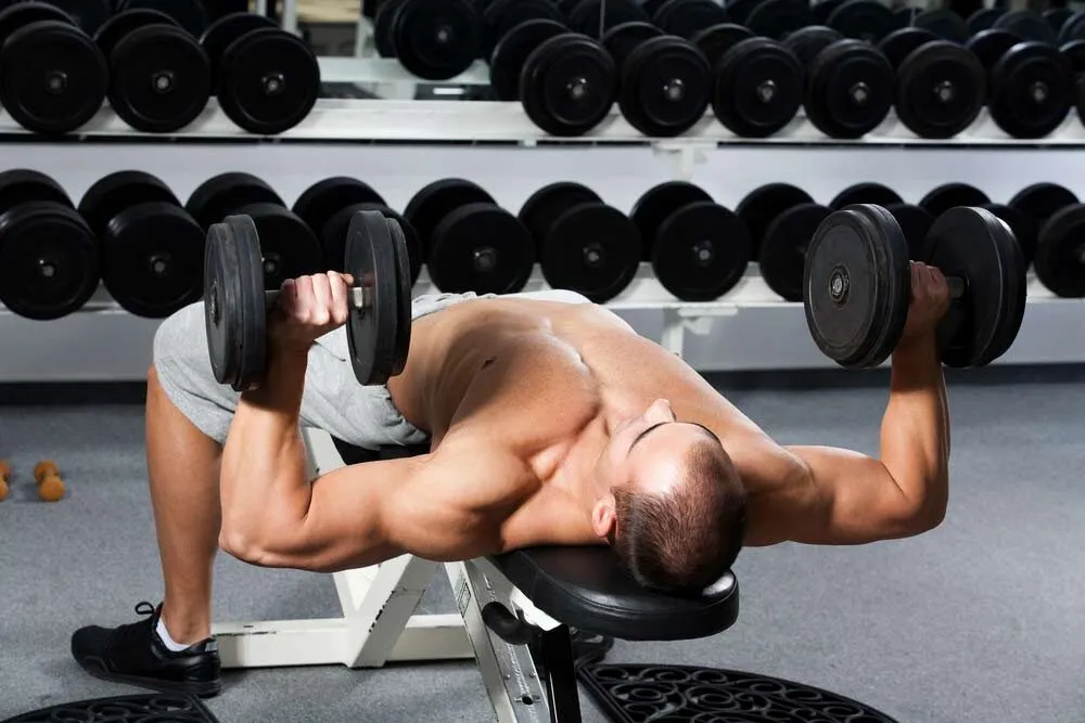 Bench pressing With A Pair Of Dumbbells