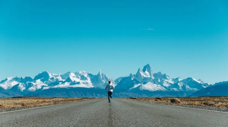 person running on road at daytime